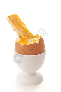 煮鸡蛋白色持有者杯子黄色食物黄油家禽蛋黄背景图片