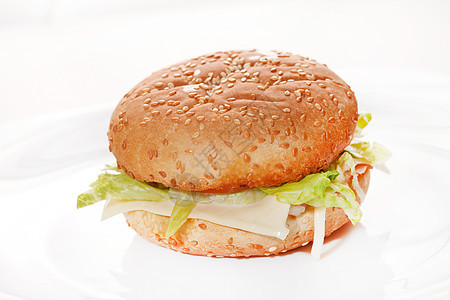 白色的汉堡包小吃午餐芝麻馅饼营养饮食晚餐火腿牛肉宏观图片