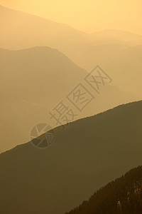 山山脉远足辉光场景旅行风景阴影日落阴霾全景天气图片