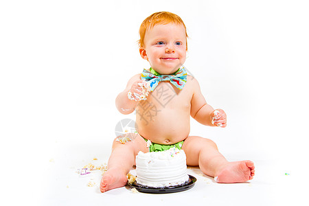 一年老蛋糕粉碎白色绿色红色尿布儿童工作室孩子头发糖果食物背景图片