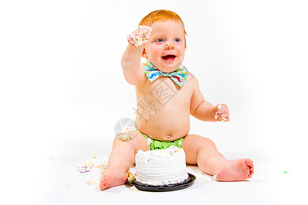 一年老蛋糕粉碎孩子糖果领结婴儿食物尿布领带白色生日孩子们背景图片