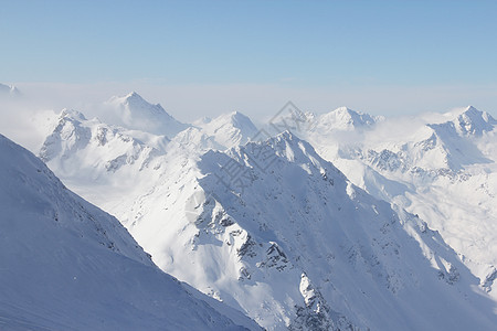 山峰峰季节旅游天空阳光假期全景滑雪旅行首脑童话图片