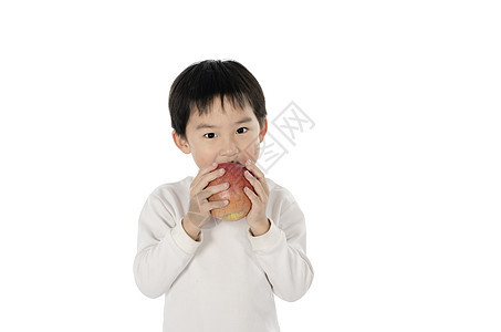 可爱的小男孩吃苹果食物红色黄色青年水果幼儿园婴儿眼睛白色小吃图片
