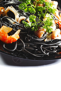 黑意面加海鲜美食盘子沙拉蔬菜食物叶子乌贼餐厅香菜宏观图片