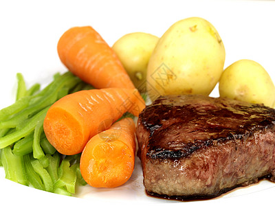 牛肉萝卜带蔬菜的填充排牛排背景