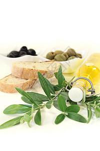 瓶装橄榄油和橄榄橄榄枝绿色产物美食家油瓶食物冷压金黄色图片