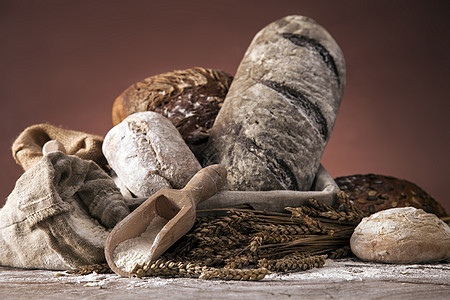 传统面包篮子地球蜂蜜木头白色包子谷物摄影棕色小麦图片