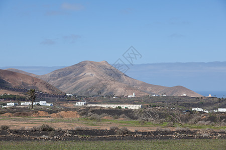 兰萨罗特的某个地方岩石时间天空目的地骨灰沙漠自然元素阳光旅行爬坡图片