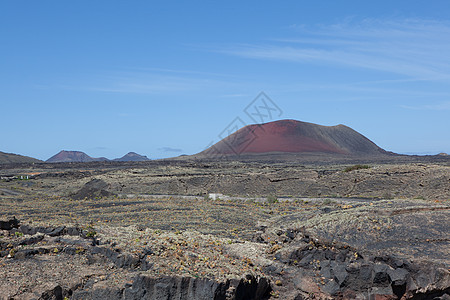 兰萨罗特的某个地方旅行阳光岩石天空时间自然元素沙漠爬坡骨灰日光图片