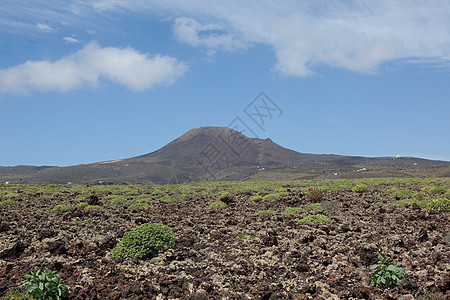 兰萨罗特的某个地方沙漠阳光爬坡骨灰日光旅行目的地岩石天空时间图片