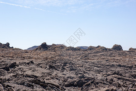 兰萨罗特的某个地方海滩旅行阳光荒野天空岩石爬坡目的地时间沙漠图片