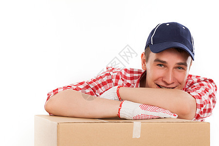 带棕色盒子的英俊年轻快递员工作室导游男性就业纸盒劳动男人送货邮政磁带图片