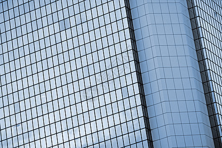 现代摩天大楼外部建筑学中心公司市中心蓝色玻璃大厦商业城市反射图片