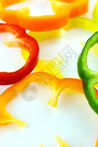 色彩多彩的甜甜胡椒片营养卫生辣椒香料烹饪食物美食橙子胡椒蔬菜图片