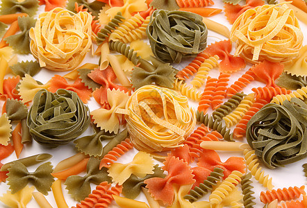 三种颜色的不同面条橙子派对黄色营养品饺子食物三色螺旋绿色图片