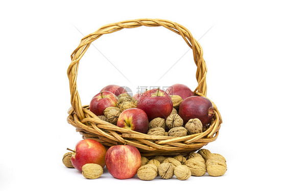 装满一篮子胡桃和苹果小吃核心季节性坚果白色健康帆布红色食物水果图片