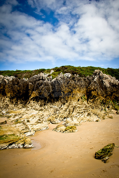 岩石海滩太阳支撑天空海浪地平线蓝色沿海阳光旅游场景图片