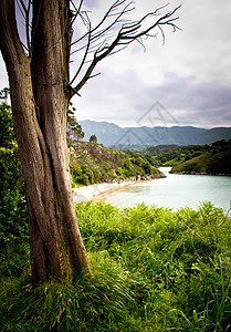 岩石海滩沿海假期石头风景海浪太阳旅行场景天空蓝色图片