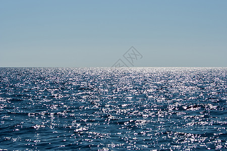 永不结束的蓝海海滩日落海洋晴天地平线天空波浪风景太阳海浪图片