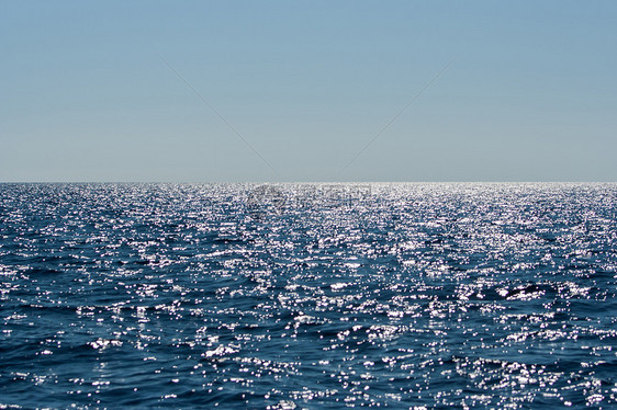 永不结束的蓝海海滩日落海洋晴天地平线天空波浪风景太阳海浪图片