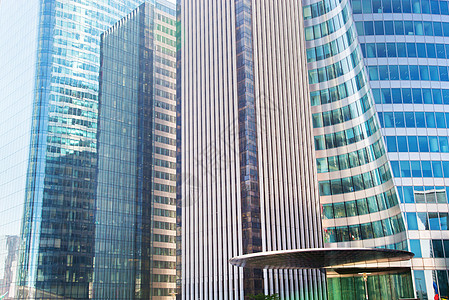 企业高楼商业摩天楼现代建筑结构背景窗户建筑学办公室防御企业蓝色中心首都高楼背景