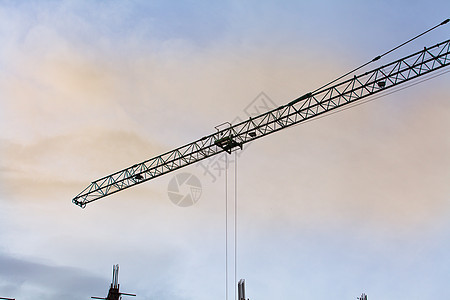 带有起重机的建筑工地太阳城市建筑学财产绝缘技术工作天空日落房子图片