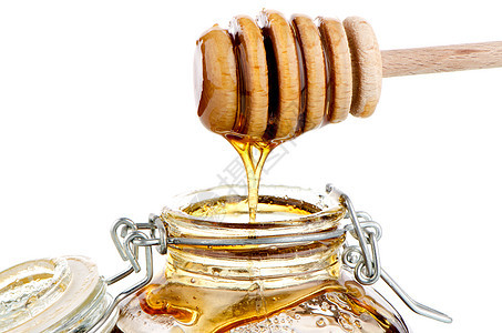 配有木制干洗机的加热蜂蜜罐用具营养早餐玻璃产品蜂蜜液体花蜜甜点治愈图片
