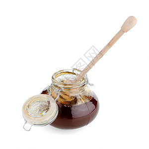 配有木制干洗机的加热蜂蜜罐甜点营养花蜜玻璃木头治愈蜂蜜金子产品液体图片