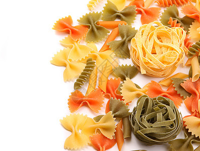 不同面食背景的 Dagliolini营养品饺子三色派对螺旋绿色橙子食物黄色面条图片
