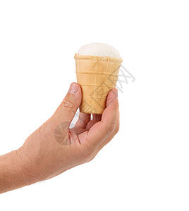 手和冰淇淋 在华夫饼杯中图片