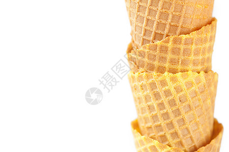 在白色上孤立的华夫饼锥味道冻结喜悦奶油食物宏观香草茶点小吃甜点图片