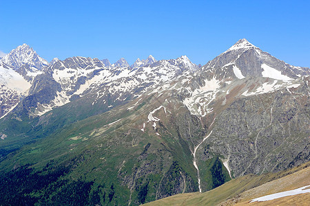 高加索山脉 Dombai季节全景森林岩石木头荒野石头顶峰首脑白色图片