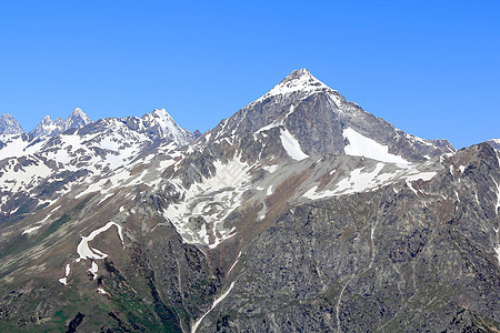俄罗斯高加索地区的落基山脉地区岩石爬坡冰川石头悬崖顶峰风景高度首脑图片