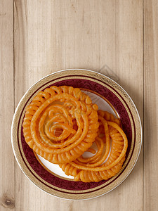 印度 Jalebi 甜食食物藏红花螺旋小吃甜点糖果油炸橙子垃圾图片