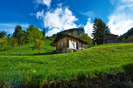 阿尔卑斯山瑞士小屋风景农村山脉岩石绿色高山旅行小木屋草地乡村图片