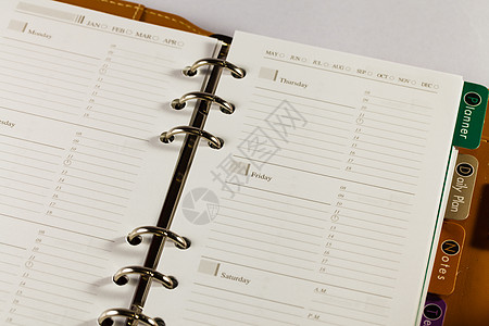 黑色笔记簿组织者对白色背法的特写图像软垫数字商业日程清单办公室床单调子笔记本规划师图片
