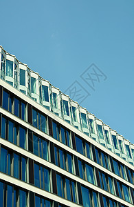 现代办公楼蓝色办公室反射房子玻璃建筑商业背景图片