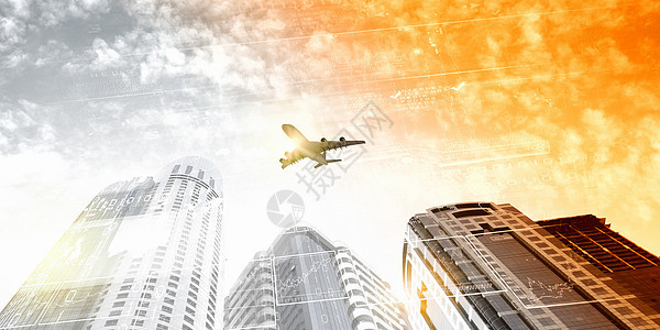 天空中的平地旅行飞机喷射运输公司客机玻璃摩天大楼高楼建筑学图片