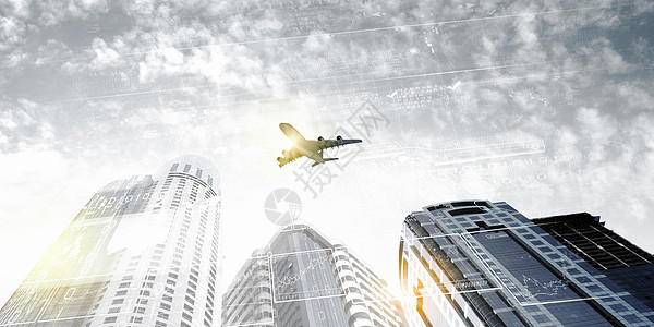 天空中的平地飞机运输公司蓝色城市建筑学高楼街道地标中心图片