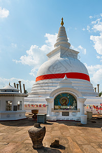 斯里兰卡的佛塔石头建筑学天空佛教徒蓝色遗产文化雕塑神社图片