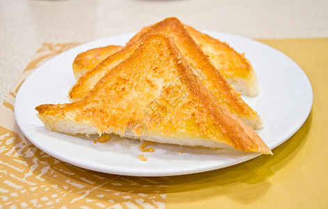 用黄油烤吐司营养白色黄油棕色美食早餐摄影水平盘子食物图片