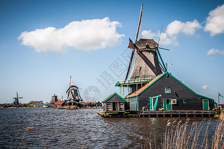 荷兰风车村荷兰风车能源翅膀木头建筑天空蓝色瓷砖背景