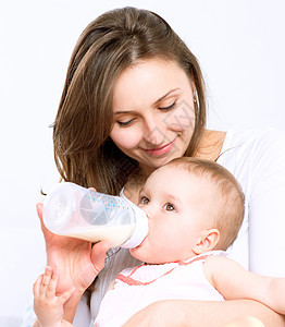 婴儿喂奶 婴儿用瓶子牛奶吃奶新生母性营养护士几个月母亲家庭奶制品女孩父母图片