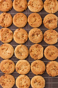 来自 cookie 的背景垃圾棕色营养小吃诱惑饼干饮食面包烘烤甜点图片