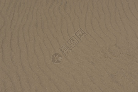 沙砂质棕色侵蚀沙漠线条热带阴影晴天海浪海滩图片