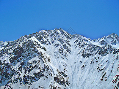 蓝天下山风景山脉岩石晴天季节石头蓝色滑雪板高山单板图片