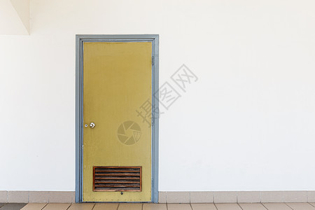 闭门入口门锁房间白墙棕色白色老门图片