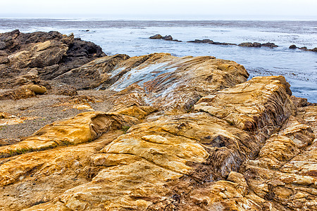 在洛博斯角国家海洋保护区的显形岩层形成情况海洋构造悬崖保护区力量外景海滩波浪栖息地岩石图片