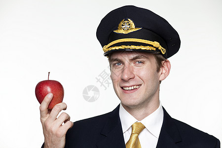 年轻男子以客机驾驶员的形式出现喷射人员天线航空衬垫男性水果全体飞行员航班图片