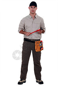 一个拿着扳手的杂工工作衬衫修理工男性牛仔布管道劳动工具衣服便利图片